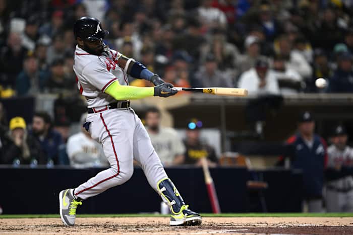 Apr 17, 2023; San Diego, California, USA; Atlanta Braves designated hitter Marcell Ozuna (20) hits a double during the fifth inning against the San Diego Padres at Petco Park. Mandatory Credit: Orlando Ramirez-USA TODAY Sports